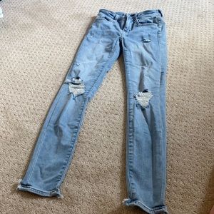 light blue jeans ripped